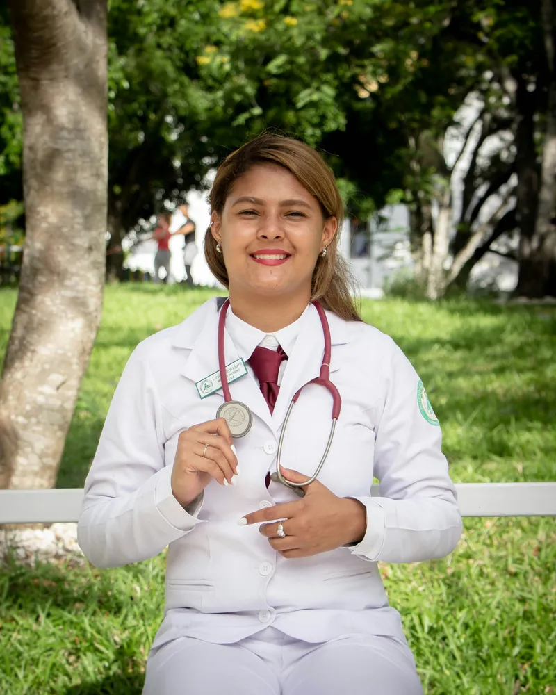 Portrait of Dr. Lakshmi Prasanna, a woman doctor in a white coat