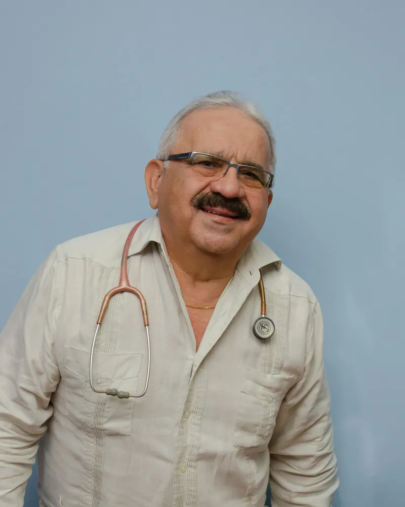 Portrait of Dr. Kiran Kumar, a man doctor in a white coat