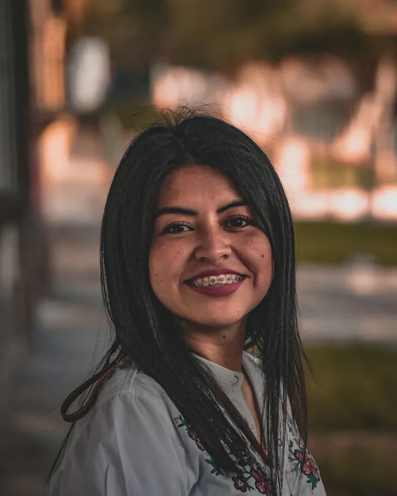 Portrait of Divya Menon, a woman counsellor smiling