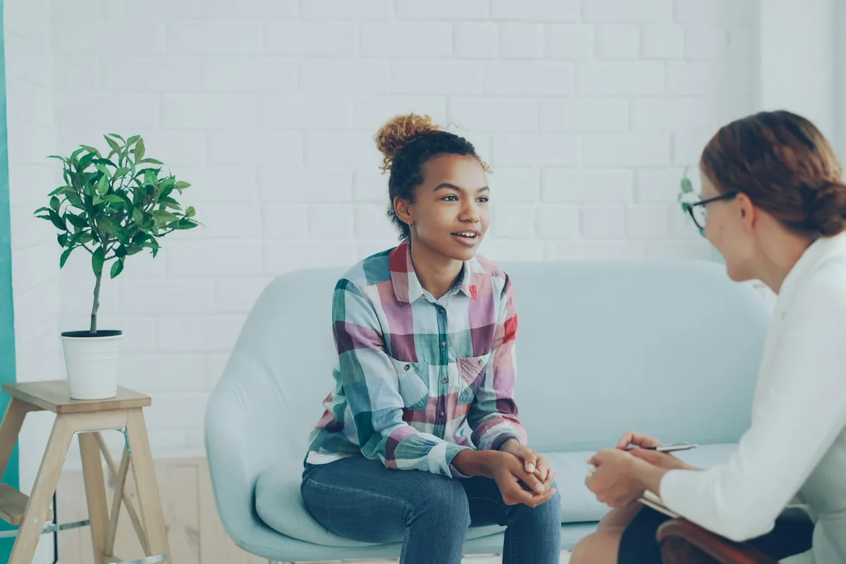 A counsellor and a patient speaking quietly